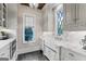 Eat-in kitchen features stainless steel appliances, custom cabinets, marble countertops, and a farmhouse sink at 140 Newhaven Dr, Fayetteville, GA 30215