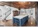 Open kitchen features a large island, wooden ceiling, stainless steel appliances, and custom cabinets at 140 Newhaven Dr, Fayetteville, GA 30215