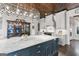Kitchen with an island, stainless steel appliances, custom cabinets, display cabinet, and designer lighting at 140 Newhaven Dr, Fayetteville, GA 30215