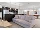 Spacious living room with a built-in bar, comfortable seating, and a pool table at 140 Newhaven Dr, Fayetteville, GA 30215