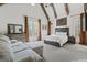 Spacious main bedroom featuring vaulted ceilings with beams, large windows, and sitting area at 140 Newhaven Dr, Fayetteville, GA 30215