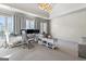 Large home office with big windows, stylish decor, and great lighting fixtures at 140 Newhaven Dr, Fayetteville, GA 30215