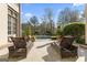 Relaxing pool area with comfortable lounge chairs and manicured landscaping with mature trees at 140 Newhaven Dr, Fayetteville, GA 30215