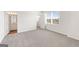 Bedroom showcasing plush neutral carpet and natural light from a large window at 315 Arwen Dr # 105, Mcdonough, GA 30252