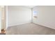 Bedroom featuring neutral carpet, a window, and open entry to hall and ensuite at 315 Arwen Dr # 105, Mcdonough, GA 30252