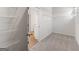 Walk-in closet featuring ample shelving and neutral carpeting throughout at 315 Arwen Dr # 105, Mcdonough, GA 30252