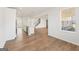 Bright, open-concept kitchen with hardwood floors and island with bar seating at 315 Arwen Dr # 105, Mcdonough, GA 30252