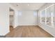 Spacious living room with wood floors, white walls, and large windows that provide plenty of natural light at 315 Arwen Dr # 105, Mcdonough, GA 30252