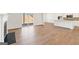 An open-concept living room boasting hardwood floors and sliding glass doors to the backyard at 315 Arwen Dr # 105, Mcdonough, GA 30252