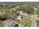 Aerial view of a home showcasing its expansive lot, landscaping, and surrounding neighborhood at 108 White Oak Tl, Cumming, GA 30028