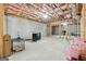 Unfinished basement featuring exposed insulation in the ceiling and concrete flooring at 108 White Oak Tl, Cumming, GA 30028