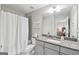 Bathroom with shower and tub combination boasts natural lighting and neutral colors at 108 White Oak Tl, Cumming, GA 30028