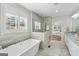 Bright bathroom features a soaking tub, walk-in shower and stylish vanity at 108 White Oak Tl, Cumming, GA 30028