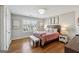 Cozy bedroom with hardwood floors and bright natural light at 108 White Oak Tl, Cumming, GA 30028
