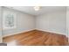 Bright bedroom with hardwood floors and window with white shutters allowing lots of natural light at 108 White Oak Tl, Cumming, GA 30028