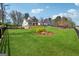 Beautiful home with an expansive front yard, mature trees, and a long driveway leading to the entrance at 108 White Oak Tl, Cumming, GA 30028