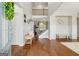 Grand foyer with hardwood floors, staircase, bench seating, and an open floor plan creating an inviting entrance at 108 White Oak Tl, Cumming, GA 30028