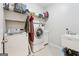 Functional laundry room with modern washer and dryer units and lots of storage space at 108 White Oak Tl, Cumming, GA 30028