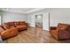 Cozy living room with hardwood floors, a view of the stairs and comfortable seating arrangement at 108 White Oak Tl, Cumming, GA 30028