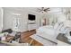 Bright main bedroom offers access to a private patio with hardwood floors and ceiling fan at 108 White Oak Tl, Cumming, GA 30028