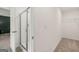 A bathroom with a tiled shower stall and a closet space, highlighting modern fixtures and neutral decor at 325 Silver Moon Dr, Loganville, GA 30052