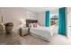 Charming bedroom with gray tufted headboard, plush carpet, and bright window at 325 Silver Moon Dr, Loganville, GA 30052