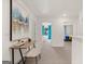 A second floor hallway with bedrooms branching off either side featuring carpet and neutral colored walls at 325 Silver Moon Dr, Loganville, GA 30052