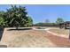 Expansive backyard with a stone-trimmed pool, fire pit, and plenty of space for outdoor activities at 1 Red Oak Trl, Sharpsburg, GA 30277