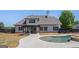 Beautiful backyard with an in-ground pool and patio area, perfect for outdoor entertaining at 1 Red Oak Trl, Sharpsburg, GA 30277