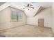 Bedroom showcasing neutral carpeting, a ceiling fan, a window, and an attic access door, maximizing space at 1 Red Oak Trl, Sharpsburg, GA 30277