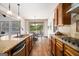 Bright kitchen features granite countertops, a breakfast nook, and a view of the outdoor pool at 1 Red Oak Trl, Sharpsburg, GA 30277