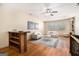 Bright upstairs living room with hardwood floors, neutral paint, ceiling fan and large windows at 1 Red Oak Trl, Sharpsburg, GA 30277