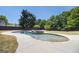 Stunning in-ground pool surrounded by lush greenery, offering a private outdoor retreat at 1 Red Oak Trl, Sharpsburg, GA 30277