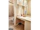 Bright bathroom featuring decorative mirrors, a bathtub, and tiled walls at 1592 Smithson Ct, Lithonia, GA 30058