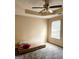 Bright bedroom features a ceiling fan, neutral walls, carpet, and a sunlit window at 1592 Smithson Ct, Lithonia, GA 30058