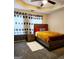 Cozy bedroom with a wood bed frame, curtains, nightstand, and neutral colored walls at 1592 Smithson Ct, Lithonia, GA 30058