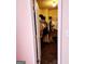 Walk-in closet featuring ample storage space, racks, and shelves for clothing at 1592 Smithson Ct, Lithonia, GA 30058