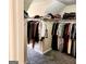 Large walk-in closet with shelves and racks for optimal storage at 1592 Smithson Ct, Lithonia, GA 30058