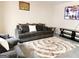 Cozy living room with plush seating, patterned rug, and entertainment center at 1592 Smithson Ct, Lithonia, GA 30058