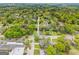 Neighborhood aerial view showcases tree-lined streets, charming homes, and a tranquil setting at 1202 Emory St, Oxford, GA 30054
