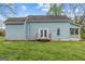 Exterior view of the house with blue siding, a small deck, and a covered porch at 1202 Emory St, Oxford, GA 30054