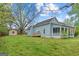 Large backyard with a shed, deck, and covered porch, perfect for outdoor activities at 1202 Emory St, Oxford, GA 30054