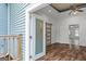 Charming balcony view into a modern living room with stylish sliding barn door entrance at 1202 Emory St, Oxford, GA 30054