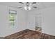Cozy bedroom with a ceiling fan and closet access at 1202 Emory St, Oxford, GA 30054