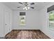 Comfortable bedroom with windows, ceiling fan, and ample natural light at 1202 Emory St, Oxford, GA 30054