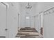 Welcoming foyer with stylish flooring and a decorative light fixture at 1202 Emory St, Oxford, GA 30054