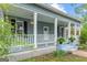 Inviting front porch with classic columns and well-maintained landscaping at 1202 Emory St, Oxford, GA 30054