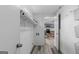 Hallway leading to kitchen offers storage baskets and shelving at 1202 Emory St, Oxford, GA 30054