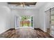 Bright living room with French doors to deck and stylish barn door entrance at 1202 Emory St, Oxford, GA 30054