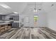 Open concept kitchen with modern gray cabinets, island and expansive living area at 1202 Emory St, Oxford, GA 30054